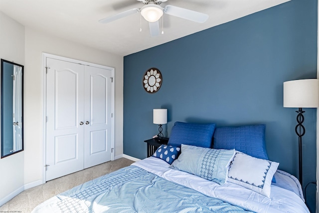 bedroom with ceiling fan and a closet