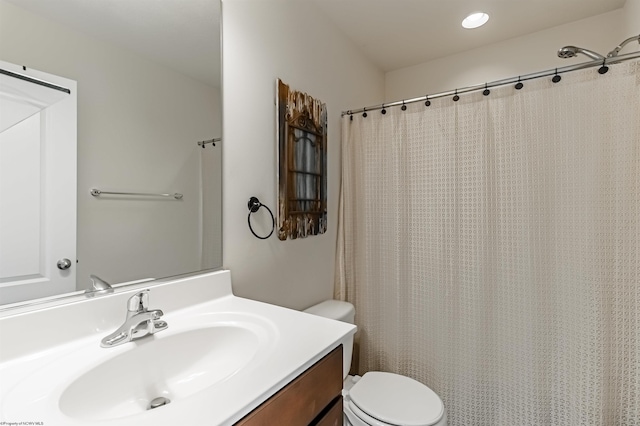 bathroom with vanity and toilet