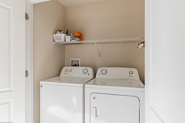 washroom with washer and dryer