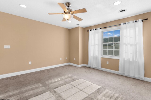 carpeted empty room with ceiling fan