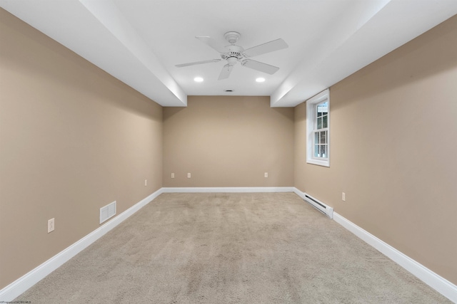 empty room with ceiling fan, carpet floors, and a baseboard radiator