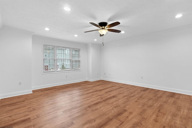 unfurnished room with light hardwood / wood-style flooring and ornamental molding