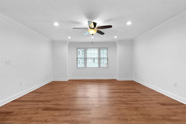 spare room featuring a textured ceiling, ceiling fan, wood-type flooring, and crown molding