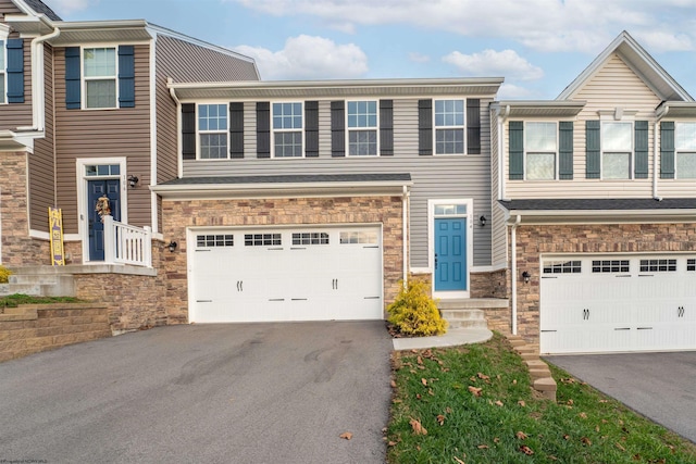 townhome / multi-family property featuring a garage