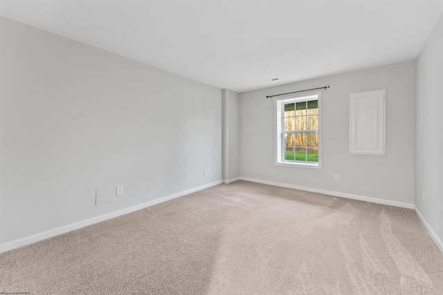 empty room featuring carpet flooring