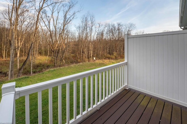 wooden terrace with a yard