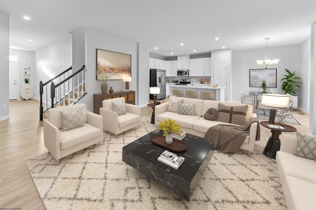 living room featuring light hardwood / wood-style flooring and a notable chandelier