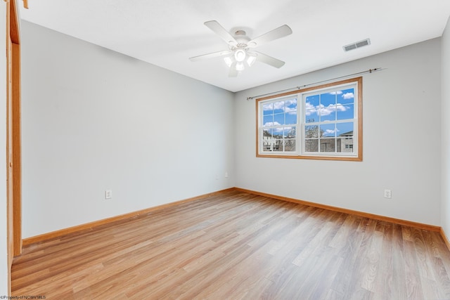 spare room featuring ceiling fan and light hardwood / wood-style flooring