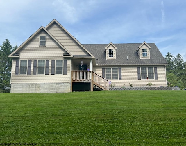 rear view of house with a yard