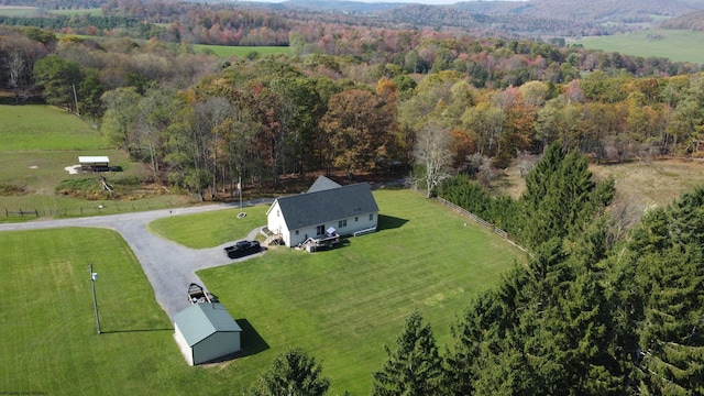 birds eye view of property with a rural view