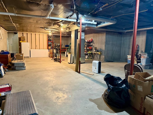 basement featuring white refrigerator