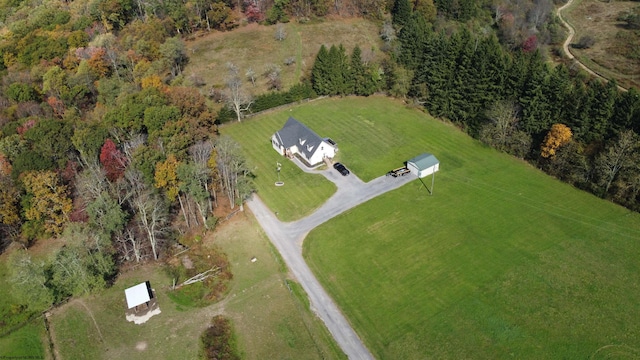 birds eye view of property with a rural view