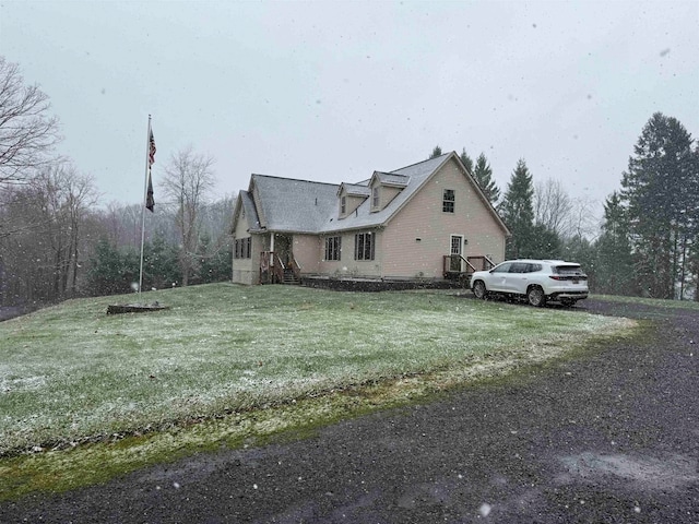 view of property exterior with a yard