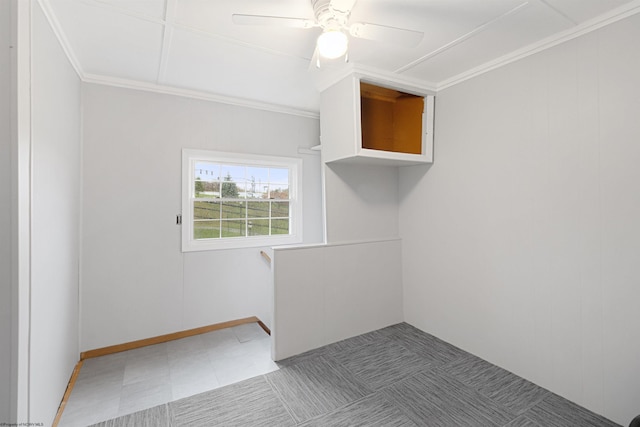 unfurnished room with ceiling fan and ornamental molding