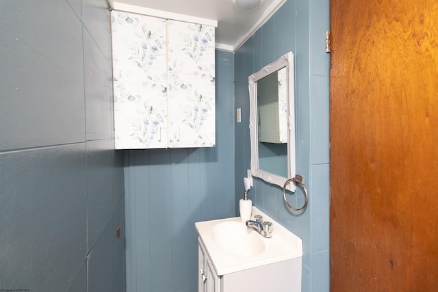 bathroom featuring crown molding and vanity