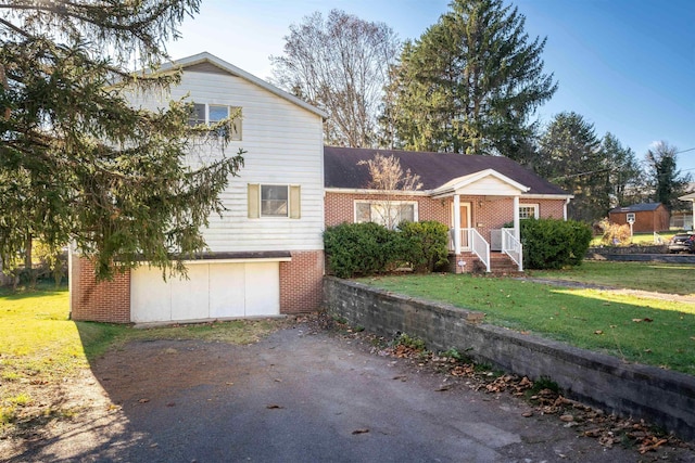 view of front of property with a garage and a front lawn