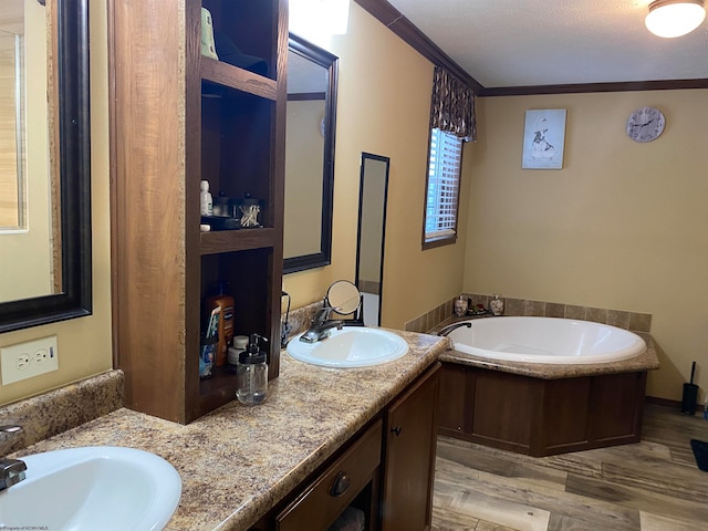 bathroom featuring a bath, vanity, wood-type flooring, and ornamental molding