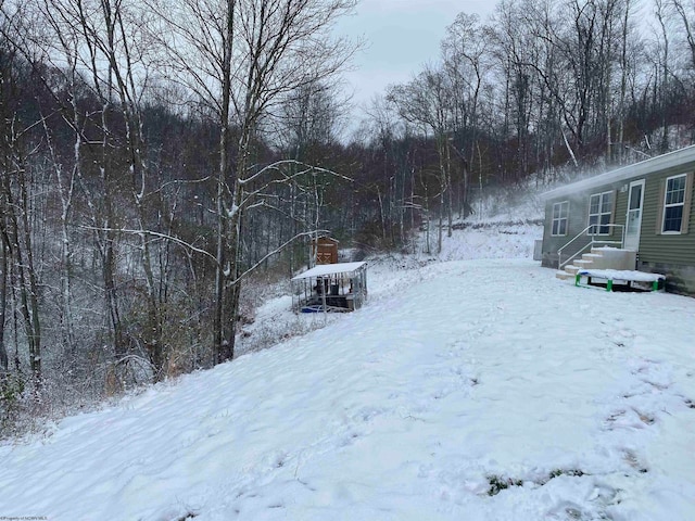 view of yard covered in snow