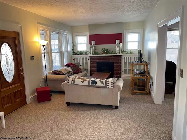 carpeted living room featuring a fireplace and a textured ceiling