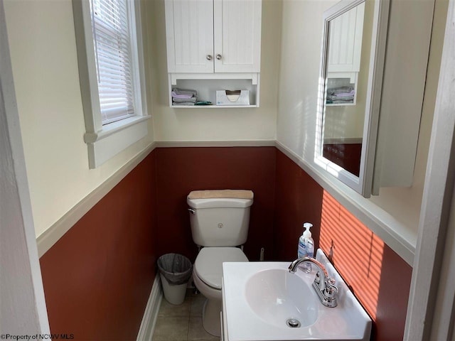 bathroom with tile patterned floors, toilet, and sink