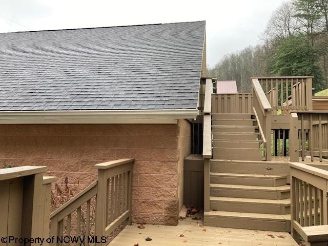 view of home's exterior with a wooden deck