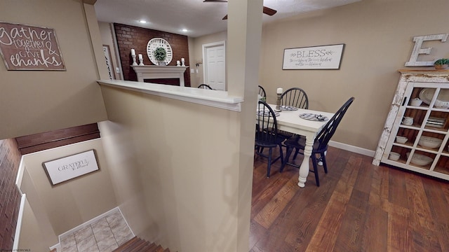 interior space with dark hardwood / wood-style flooring and ceiling fan