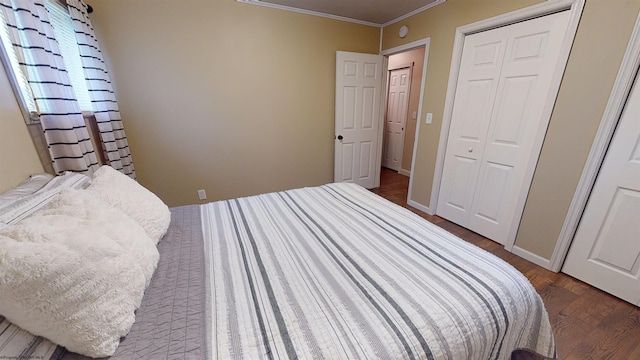 bedroom featuring dark wood-type flooring and ornamental molding