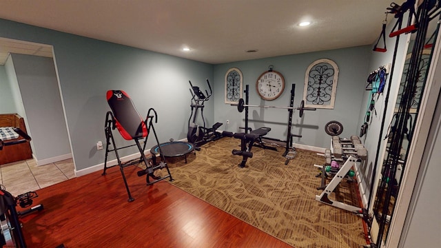 workout room featuring light hardwood / wood-style floors