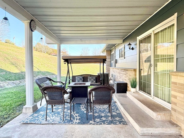 view of patio with a fire pit