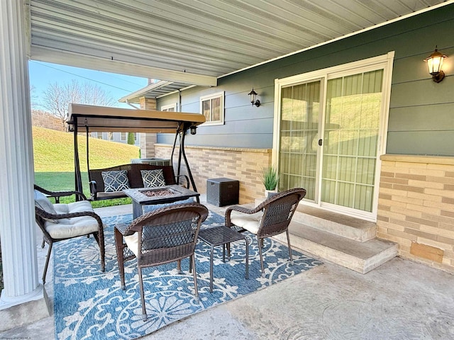 view of patio / terrace featuring a fire pit