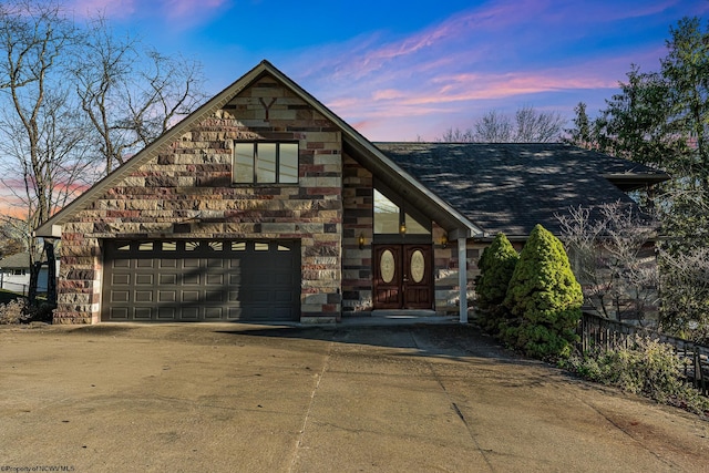 view of front of property with a garage