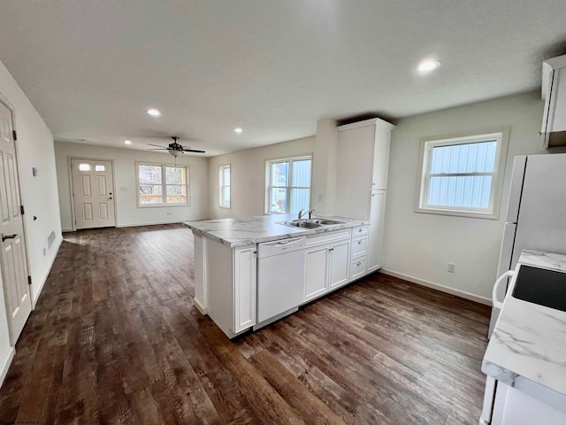 kitchen with white cabinets, ceiling fan, dark hardwood / wood-style floors, and white appliances