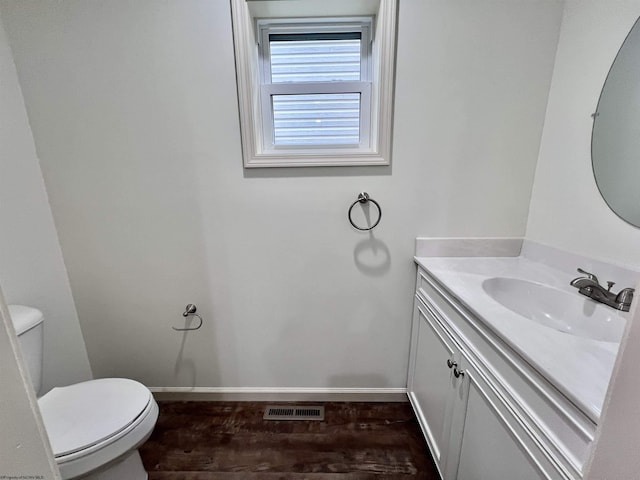 5 River St, Elkins, WV 26241 - bathroom featuring toilet, vanity, wood finished floors, and baseboards