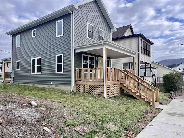 5 River St, Elkins, WV 26241 - view of property exterior featuring a porch, crawl space, a lawn, and stairway