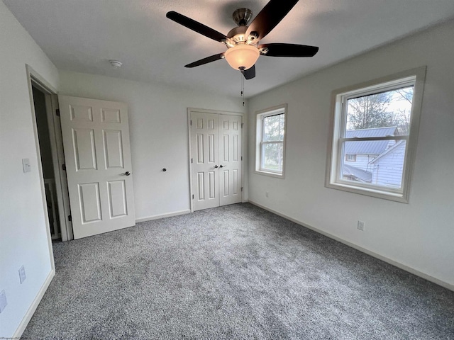 5 River St, Elkins, WV 26241 - unfurnished bedroom featuring carpet flooring, baseboards, a closet, and a ceiling fan