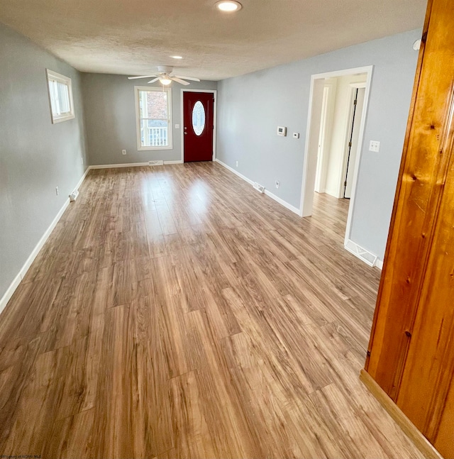 entrance foyer featuring light hardwood / wood-style flooring and ceiling fan