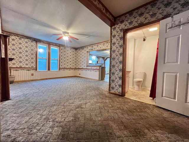 unfurnished living room featuring carpet flooring and ceiling fan