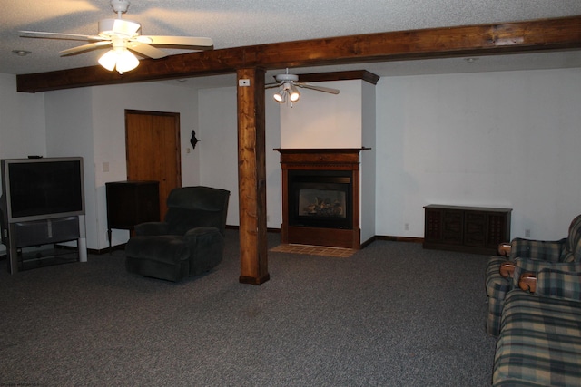 living room with carpet flooring, a textured ceiling, ceiling fan, and beamed ceiling