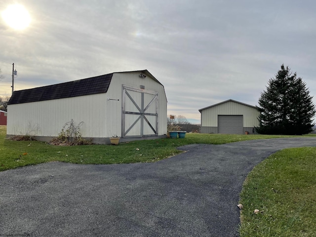 view of outbuilding with a yard