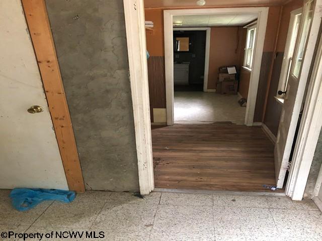 hallway featuring hardwood / wood-style flooring