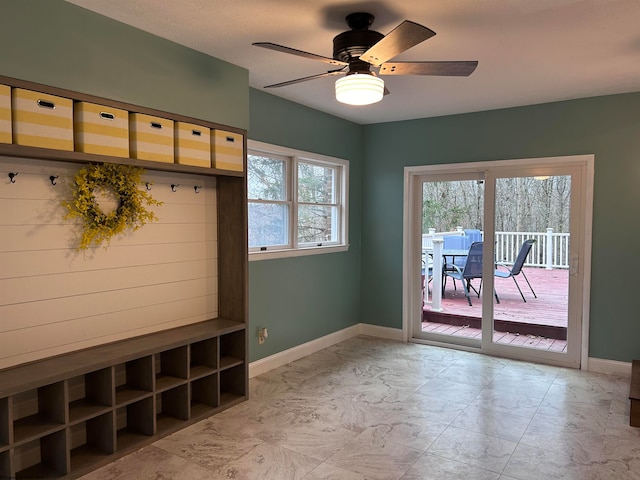 mudroom with plenty of natural light and ceiling fan