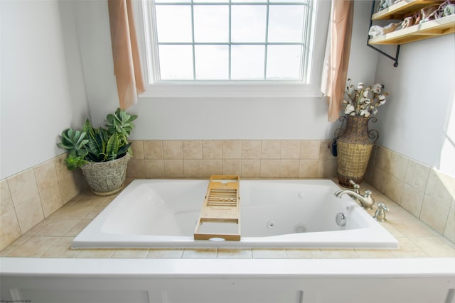 bathroom with tiled bath