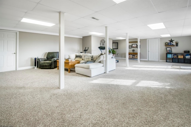 basement with carpet floors and a paneled ceiling