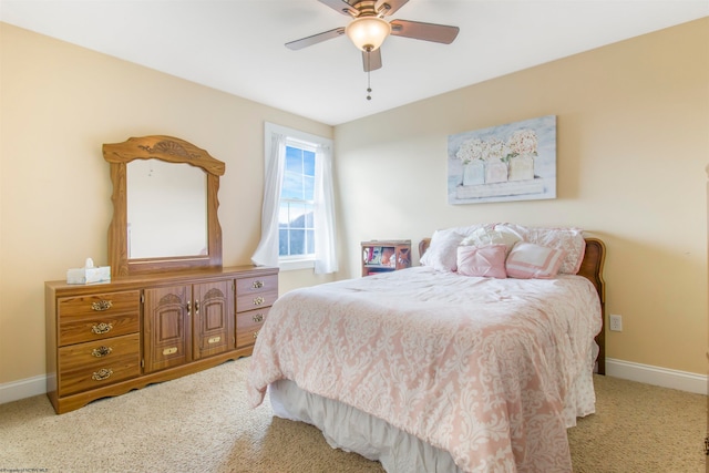 bedroom featuring ceiling fan and light carpet