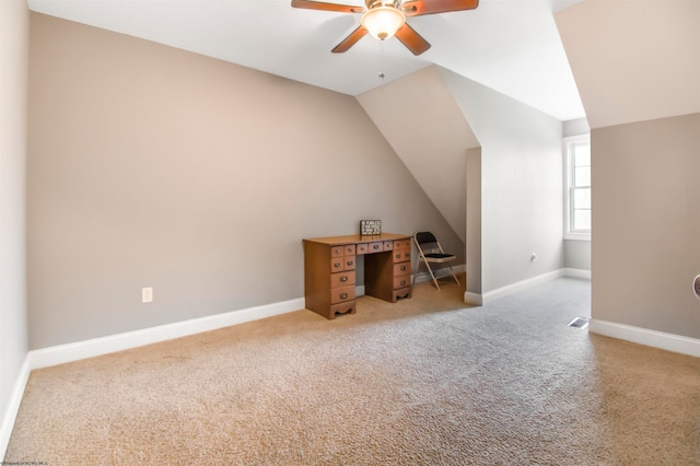 additional living space with carpet, ceiling fan, and vaulted ceiling