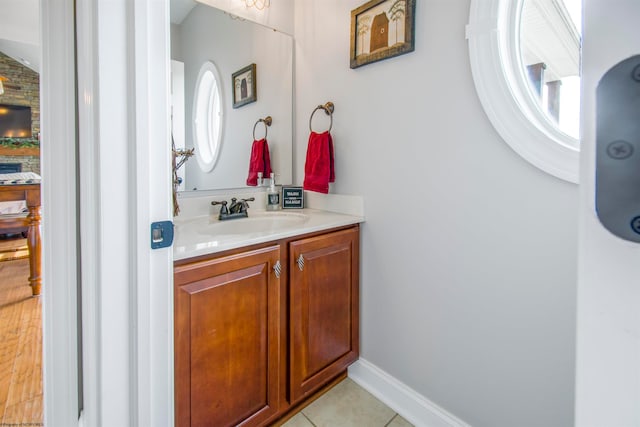 bathroom featuring hardwood / wood-style flooring, vanity, and a wealth of natural light