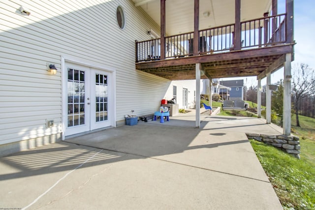 view of patio featuring french doors and a deck