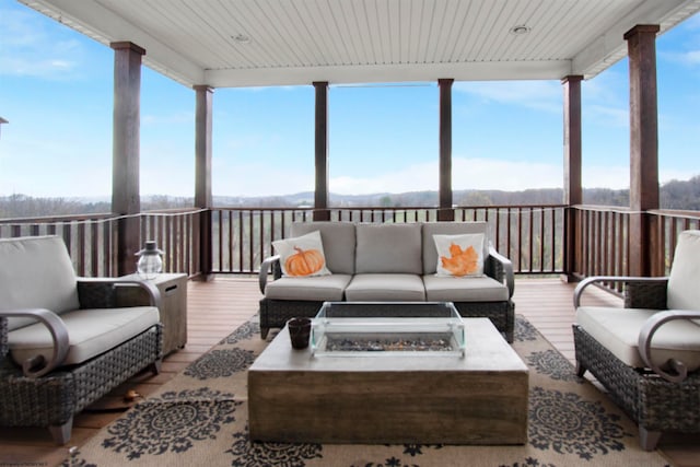 sunroom featuring wood ceiling and a healthy amount of sunlight