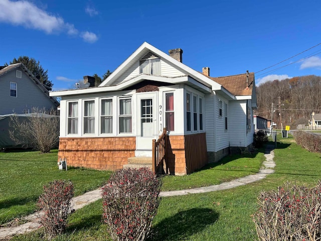 bungalow with a front yard