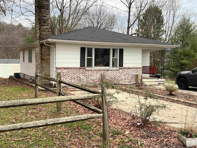 view of front of home featuring central air condition unit